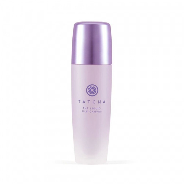 Tatcha The Liquid Silk Canvas Featherweight Protective Primer in purple plastic bottle on white background 